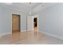 Neutral-colored bedroom with hardwood floors, crown molding, and recessed lighting at 2255 Peachtree Ne Rd # 426, Atlanta, GA 30309