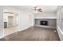 Open-concept living room with fireplace connected to the updated kitchen at 2653 Del Ridge Dr, Douglasville, GA 30135