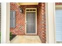Close-up of a front door showcasing the brick facade and covered entryway of the home at 3374 Thornbridge Dr, Powder Springs, GA 30127