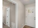 Inviting foyer with a modern front door and neutral color palette at 2239 Pinewood Dr, Decatur, GA 30032