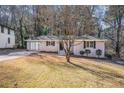 Charming brick home featuring a well-manicured lawn and a welcoming entrance at 2239 Pinewood Dr, Decatur, GA 30032