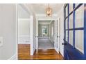 Welcoming entryway with hardwood floors, glass paneled door and decorative light fixture at 860 Valleymeade Se Dr, Marietta, GA 30067