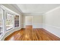 Bright living room featuring hardwood floors, large bay window, and neutral paint at 860 Valleymeade Se Dr, Marietta, GA 30067