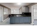 Modern kitchen with marble countertop, stainless steel sink and pendant lighting at 3068 River Oak Rd, Decatur, GA 30034