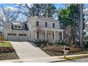 Beautiful two-story home with an attached two-car garage and manicured landscaping at 52 25Th Nw St, Atlanta, GA 30309