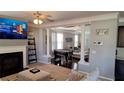 Elegant living room featuring a fireplace, hardwood floors, and an open layout at 4402 Alysheba Dr, Fairburn, GA 30213