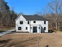 Beautiful two-story home with white siding, black roof, and a well-maintained lawn, providing classic curb appeal at 5760 Pearson Rd, Powder Springs, GA 30127