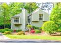 Two-story home with a well maintained lawn and lush landscaping at 2191 Spear Point Dr, Marietta, GA 30062