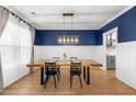 Stylish dining room featuring modern light fixture and large table with seating for six at 231 Sisson Ne Ave, Atlanta, GA 30317