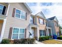 Side view of townhouses shows manicured shrubs and a convenient satellite dish at 2326 Bigwood Trl, Atlanta, GA 30349