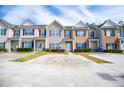Townhouse complex showcases ample parking, well-kept lawns, and tidy landscaping at 2326 Bigwood Trl, Atlanta, GA 30349