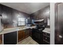 Efficient kitchen featuring dark wood cabinets, laminate countertops, and essential appliances at 2284 Emerald Springs Dr, Decatur, GA 30035