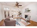 Inviting living room featuring a fireplace, hardwood floors, and a large windows to the deck at 2661 Rivers Edge Ne Dr, Atlanta, GA 30324