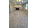 Bright living room features plush carpeting and inviting fireplace at 3924 Veracruz Dr, Decatur, GA 30034