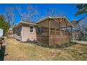Exterior angle view featuring a charming covered porch, fresh landscaping, and convenient parking space at 1826 Terry Mill Se Rd, Atlanta, GA 30316