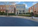 Inviting two-story townhome with meticulous landscaping and charming architectural details at 3112 Neal Ct, Cumming, GA 30041