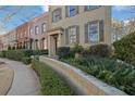 Charming street view of brick townhomes with well-maintained landscaping and inviting entrances at 3112 Neal Ct, Cumming, GA 30041