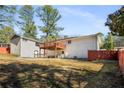 Expansive backyard featuring a spacious deck, perfect for outdoor entertaining and relaxation at 405 Cativo Dr Sw, Chattahoochee Hills, GA 30311