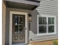 A close up of the front door and the house number of the home at 5455 Blossomwood Sw Trl, Mableton, GA 30126