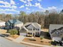 Aerial view of a lovely home with a well-kept yard and a peaceful neighborhood setting at 485 St Annes Pl, Covington, GA 30016