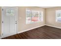 Cozy living room area with wood flooring and a well-lit entryway at 2867 Mitchell Dr, Decatur, GA 30032