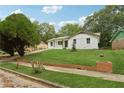 Charming single story brick home with an expansive well maintained front yard at 2005 Simmons Ave, Atlanta, GA 30337
