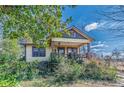 Charming bungalow featuring a cozy front porch and mature landscaping at 3630 Union Ave, Hapeville, GA 30354