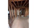Large living room with natural light and exposed beams ready for renovation at 3518 Hamlin Cir, Atlanta, GA 30341