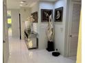 Bright hallway with white floors, stylish decor, and doorways to other rooms at 361 17Th Nw St # 2423, Atlanta, GA 30363