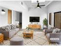 Bright living room with a ceiling fan, skylight, modern furnishings, and neutral decor at 5780 Par Four Ct, Lithonia, GA 30038