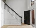 Staircase and entryway featuring sleek design, high ceilings, and abundant natural light at 1471 Adair Hill Ct, Dacula, GA 30019