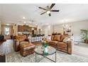 Inviting living area with a comfortable leather sofa and a clear view into the modern kitchen at 599 Collections Dr, Lawrenceville, GA 30043