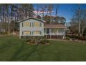 Exterior of a two-story home with a well-manicured lawn at dusk at 322 Foxfire Sw Dr, Smyrna, GA 30082