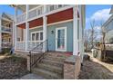 Close up view of the front porch entrance with brick steps on this two story home at 1032 Lena Nw St, Atlanta, GA 30314