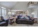 Comfortable living room featuring vaulted ceilings, an open floor plan, and a view into the gourmet kitchen at 2139 Golden Morning Ct, Kennesaw, GA 30152