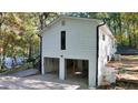 Spacious two-car garage with upper level above, connected by a staircase at 2450 Spring Mill Cv, Duluth, GA 30097