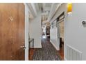 Hallway with hardwood floors and exposed ductwork leading to the apartment's living areas and bedroom at 805 Peachtree Ne St # 614, Atlanta, GA 30308