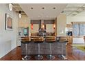 Beautiful kitchen featuring stainless steel appliances, custom cabinetry, and a tiled kitchen island with bar stools at 805 Peachtree Ne St # 614, Atlanta, GA 30308