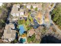 An aerial view of the property with the tennis court and swimming pool at 1250 Parkwood Se Cir # 2114, Atlanta, GA 30339