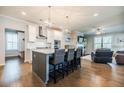 Open concept kitchen with a center island, stainless steel appliances, and seamless flow to the living area at 2845 Jims Ne Rd, Marietta, GA 30066