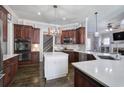 Modern kitchen featuring stainless steel appliances, a center island with marble countertops, and custom cabinetry at 3759 Maryhill Nw Ln, Kennesaw, GA 30152