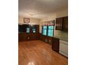 Cozy dining room featuring a charming chandelier, wood paneled walls, and natural light at 2657 Langland Ne Ct, Atlanta, GA 30345