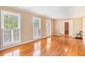 Bright living room boasts hardwood floors and lots of natural light from large windows at 2657 Langland Ne Ct, Atlanta, GA 30345