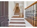 Inviting entryway showcasing hardwood floors and a staircase leading to the upper levels of the home at 911 Telfair Close, Sandy Springs, GA 30350