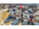 An aerial view of townhomes, highlighting their layout, driveways, and proximity to the surrounding community at 2502 Capella Sw Cir, Atlanta, GA 30331