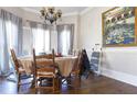 Cozy dining room with wood floors, round table, and bright natural lighting at 3440 Caleb Rd, Snellville, GA 30039