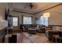 Inviting living room with tray ceiling, plush seating, and lots of natural light at 4985 Union St, Union City, GA 30291