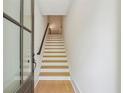 View of the entryway featuring light wood steps and flooring, leading up to the next level at 1041 Endeavour Ct, Marietta, GA 30064