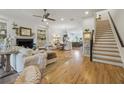 Elegant living area featuring a fireplace, hardwood floors, and neutral-toned furniture at 1041 Endeavour Ct, Marietta, GA 30064