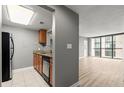 Cozy kitchen offering stainless steel appliances and granite countertops open to living area at 1280 W Peachtree Nw St # 3303, Atlanta, GA 30309